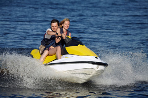 people riding jet ski